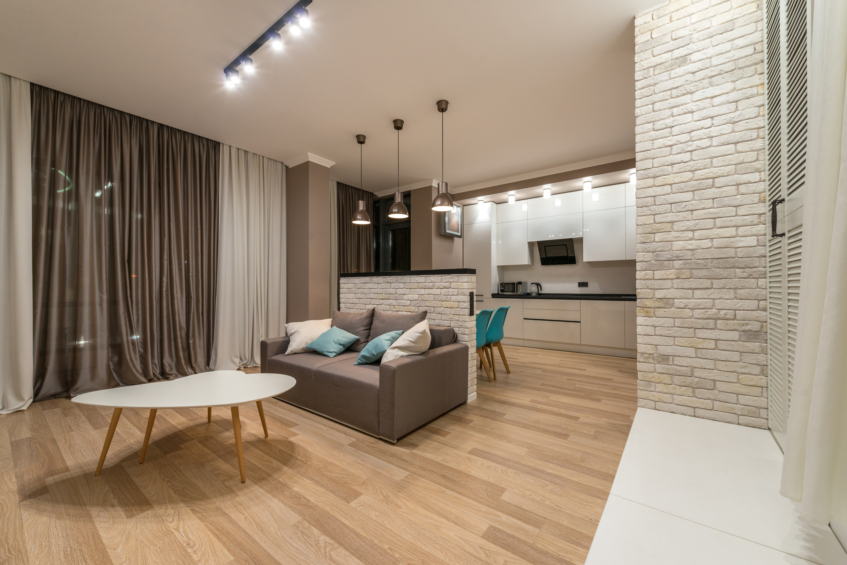 Living room with couch near kitchen